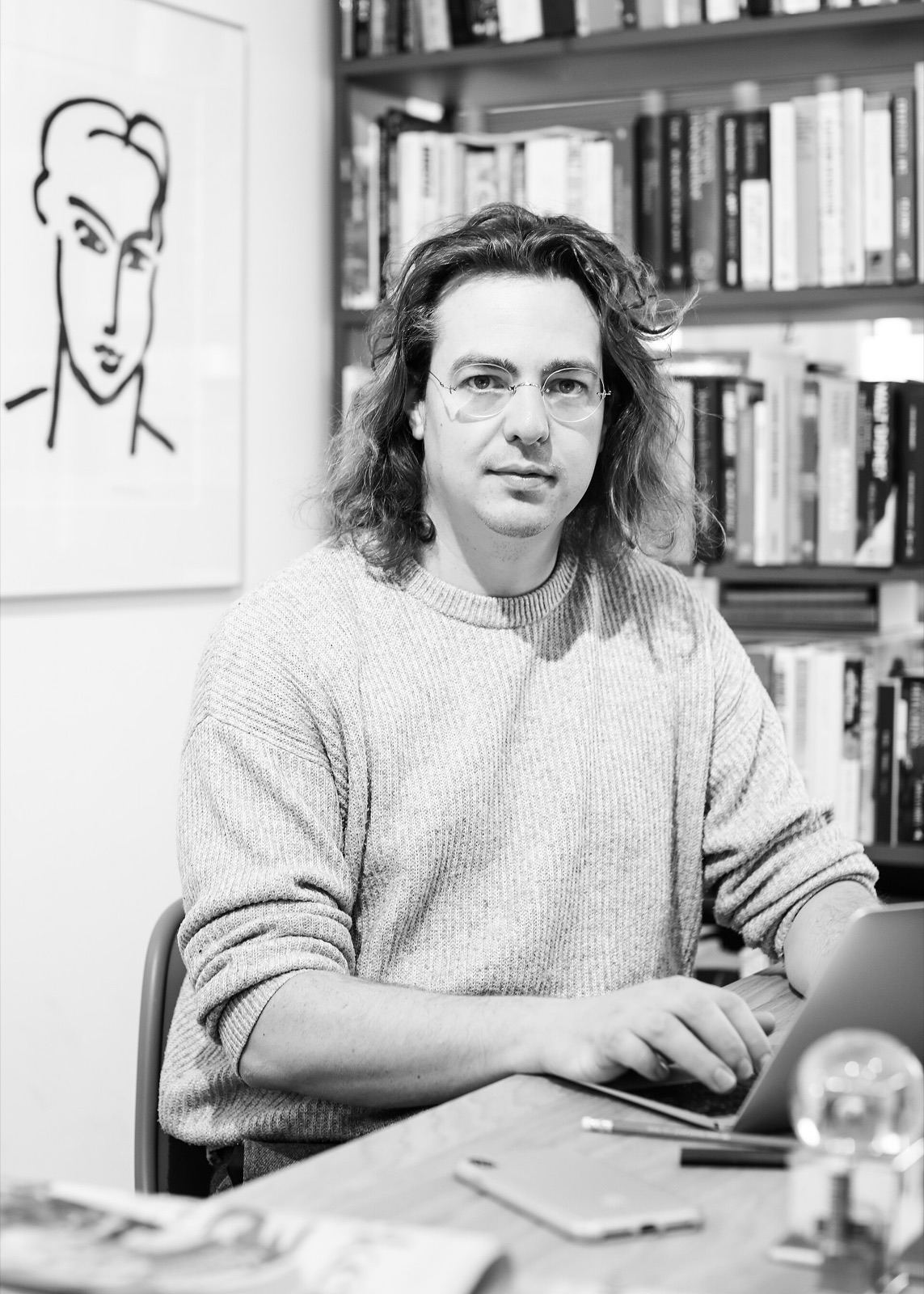A founder working from his office desk